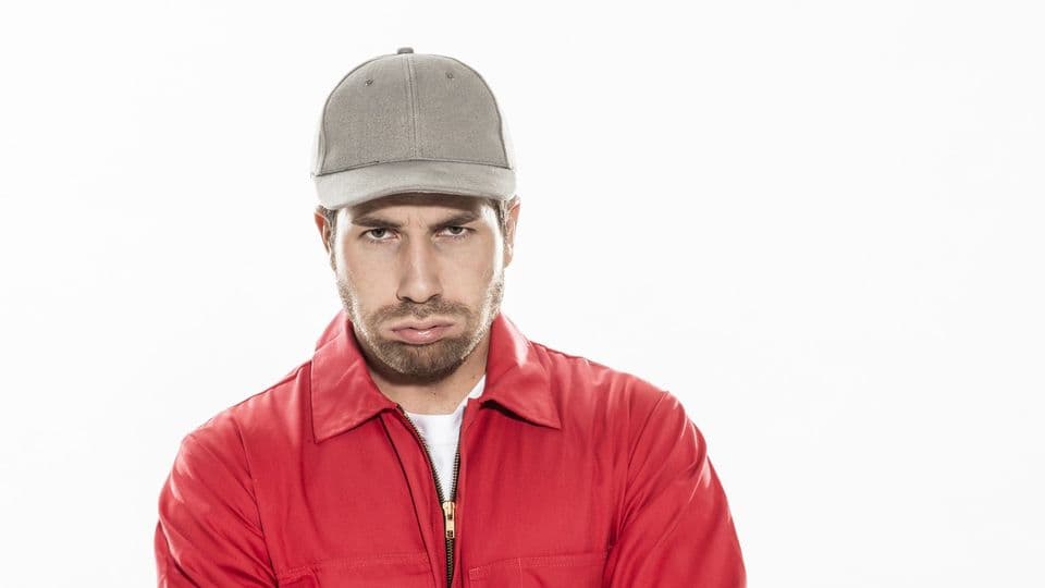 closeup portrait of a man with expressive face in workwear